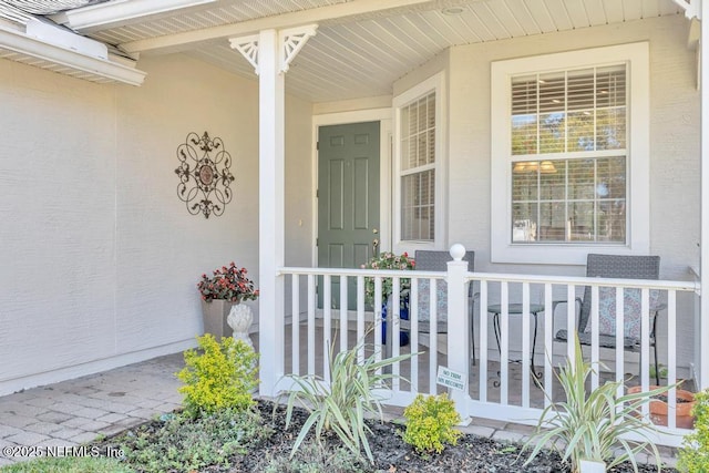 714 Copperhead Cir, Saint Augustine, FL 32092 - view of exterior entry with a porch