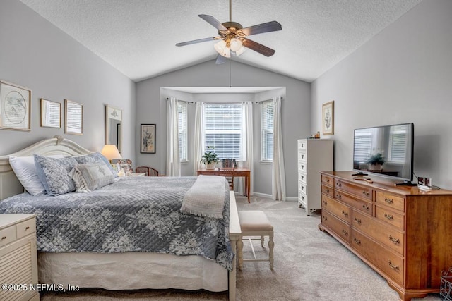714 Copperhead Cir, Saint Augustine, FL 32092 - bedroom with a textured ceiling, baseboards, ceiling fan, light carpet, and vaulted ceiling