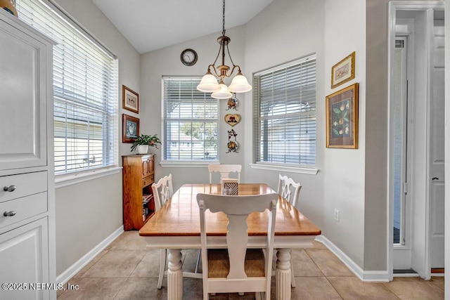 714 Copperhead Cir, Saint Augustine, FL 32092 - dining room featuring vaulted ceiling, a notable chandelier, baseboards, and light tile patterned floors