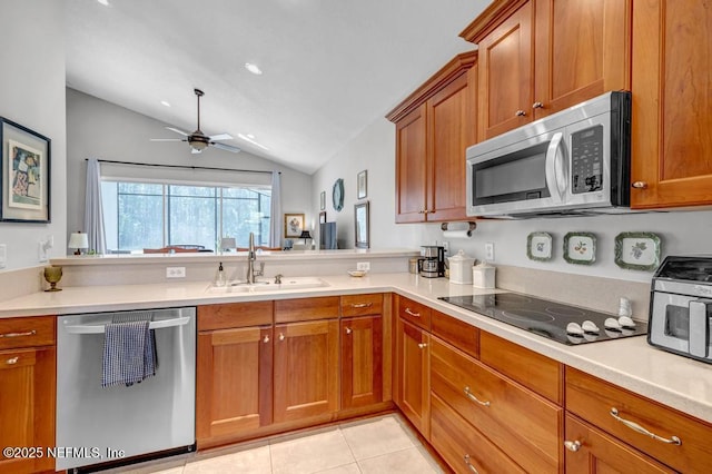 714 Copperhead Cir, Saint Augustine, FL 32092 - kitchen featuring ceiling fan, brown cabinets, appliances with stainless steel finishes, a sink, and light tile patterned floors