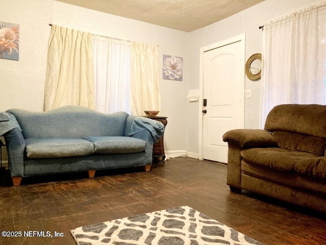1533 W 16th St, Jacksonville, FL 32209 - living room featuring a textured ceiling and wood finished floors