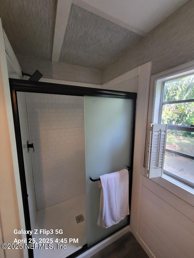 bathroom featuring a shower stall