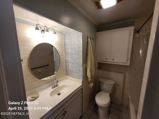 bathroom with walk in shower, tile patterned flooring, ornamental molding, toilet, and vanity