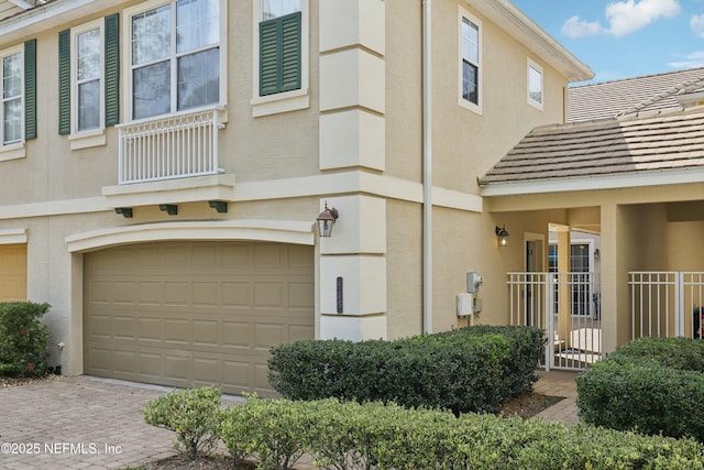 535 Hedgewood Dr, Saint Augustine, FL 32092 - exterior space with decorative driveway, stucco siding, and a garage