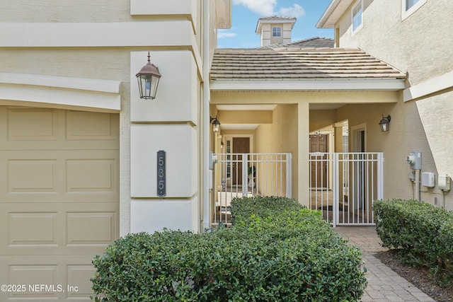 535 Hedgewood Dr, Saint Augustine, FL 32092 - doorway to property with a tile roof and stucco siding