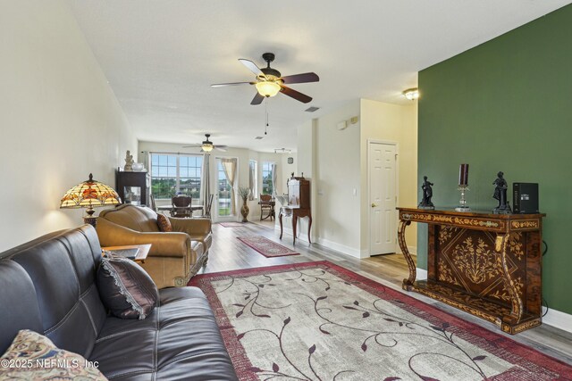 535 Hedgewood Dr, Saint Augustine, FL 32092 - living area featuring wood finished floors, visible vents, baseboards, and ceiling fan