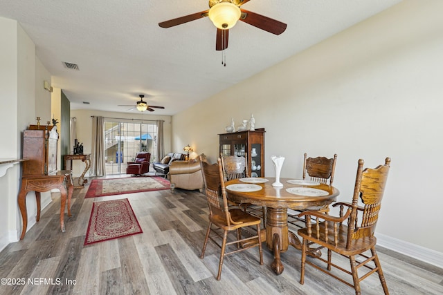 535 Hedgewood Dr, Saint Augustine, FL 32092 - dining space featuring a textured ceiling, visible vents, baseboards, ceiling fan, and light wood-type flooring