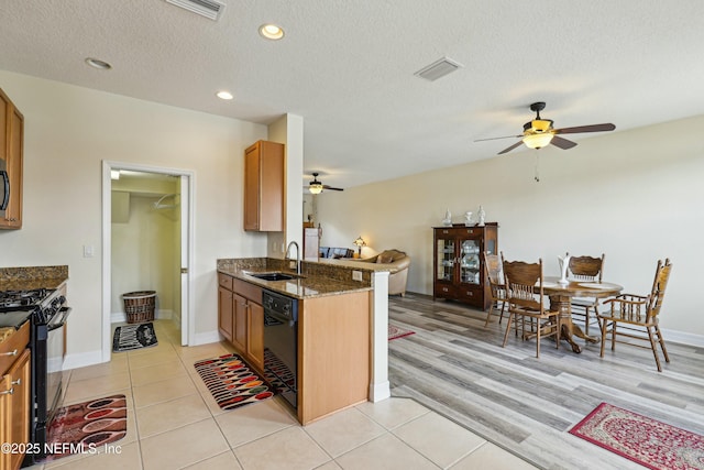 535 Hedgewood Dr, Saint Augustine, FL 32092 - kitchen with a sink, visible vents, ceiling fan, and black appliances