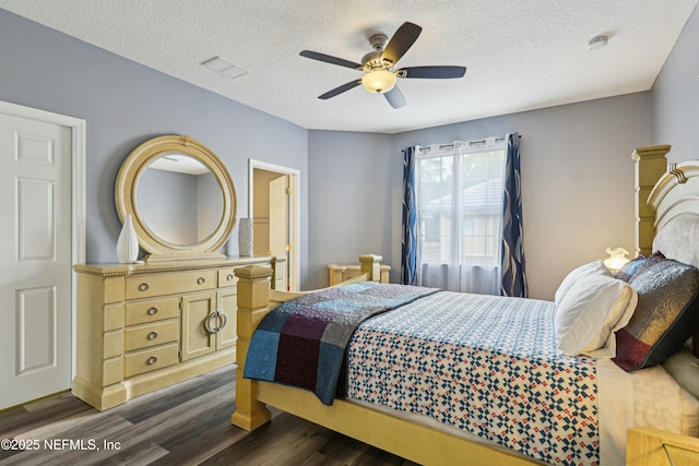 535 Hedgewood Dr, Saint Augustine, FL 32092 - bedroom with visible vents, dark wood-type flooring, ceiling fan, and a textured ceiling