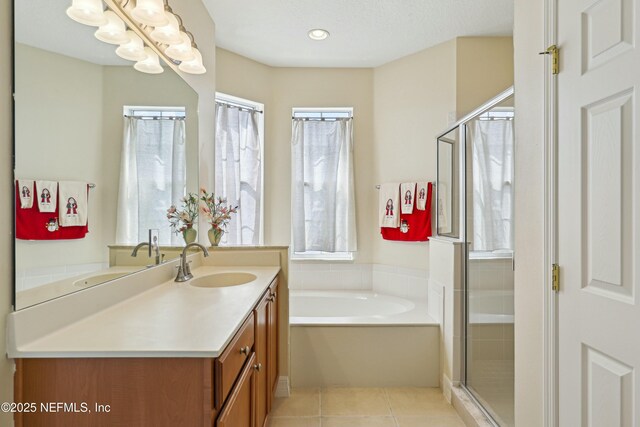 535 Hedgewood Dr, Saint Augustine, FL 32092 - full bath featuring tile patterned flooring, vanity, a bath, and a shower stall