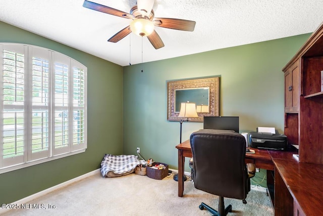 office featuring ceiling fan, baseboards, carpet, and plenty of natural light
