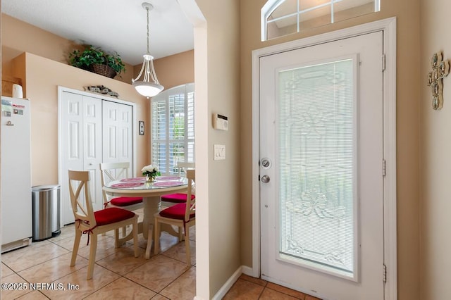 foyer entrance featuring light tile patterned floors