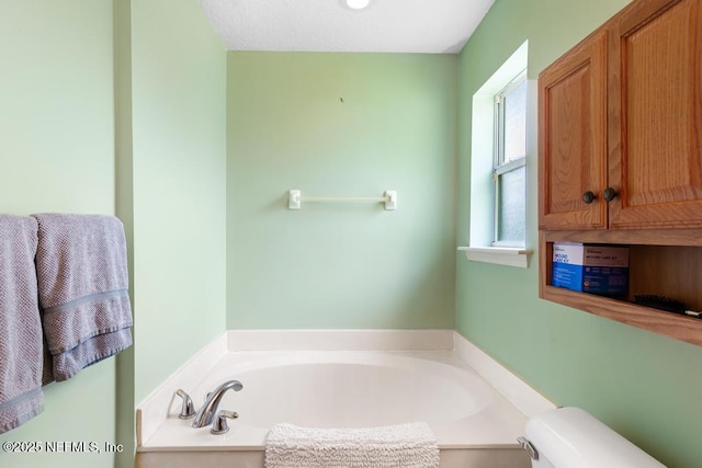 full bath with toilet and a bath
