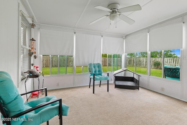 sunroom / solarium featuring ceiling fan