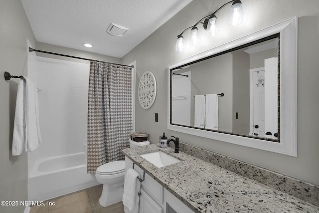 bathroom with shower / bath combo, a textured ceiling, toilet, vanity, and tile patterned flooring