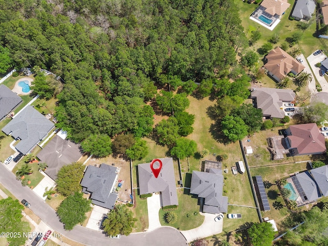 birds eye view of property with a residential view