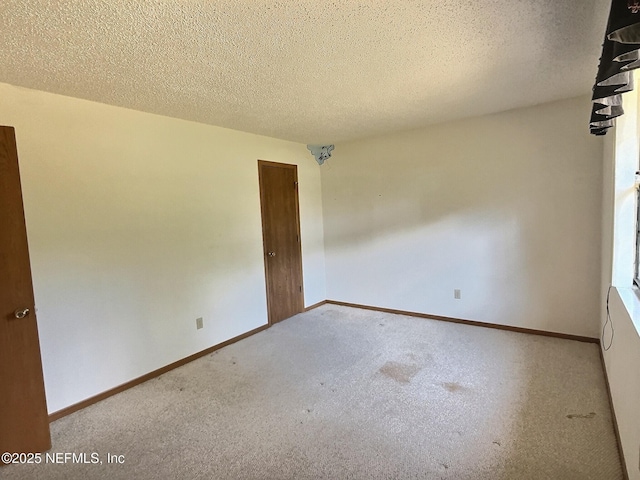 38 Rymer Ln, Palm Coast, FL 32164 - carpeted empty room featuring baseboards and a textured ceiling
