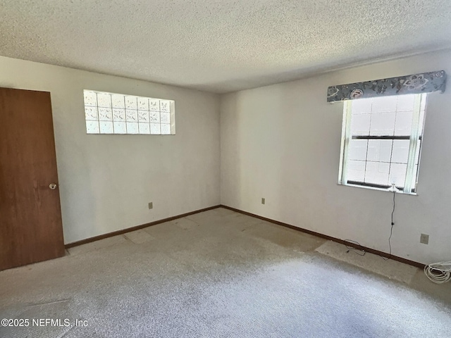 38 Rymer Ln, Palm Coast, FL 32164 - carpeted empty room featuring baseboards and a textured ceiling