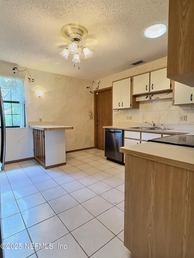 38 Rymer Ln, Palm Coast, FL 32164 - kitchen with a sink, white cabinetry, a textured ceiling, and dishwasher