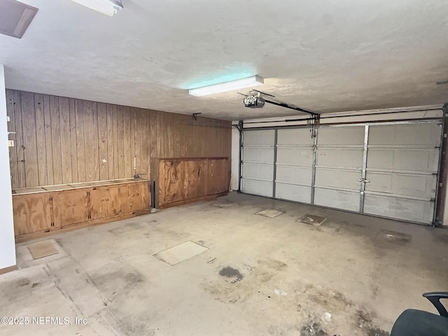 38 Rymer Ln, Palm Coast, FL 32164 - garage featuring a garage door opener and wooden walls