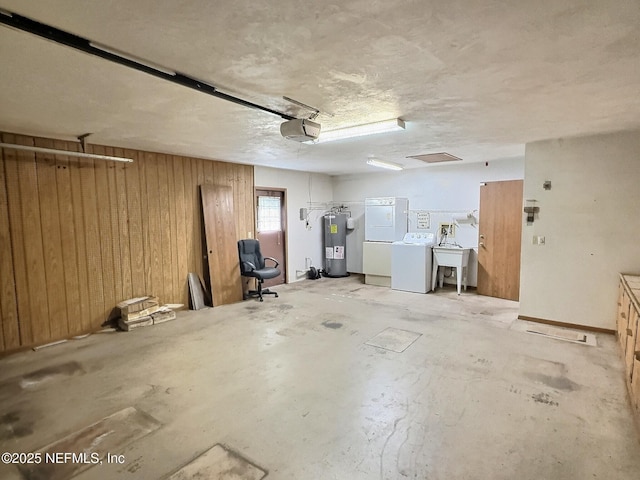 38 Rymer Ln, Palm Coast, FL 32164 - garage with water heater, a garage door opener, wood walls, and a sink