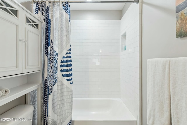 full bath with toilet and shower / bath combo
