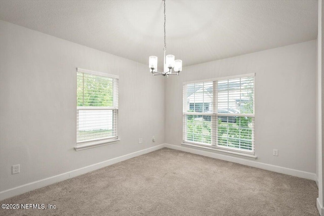 7271 Gateway Ct, Jacksonville, FL 32219 - carpeted spare room with a chandelier and baseboards
