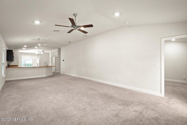 7271 Gateway Ct, Jacksonville, FL 32219 - unfurnished living room with vaulted ceiling, light colored carpet, baseboards, recessed lighting, and a ceiling fan