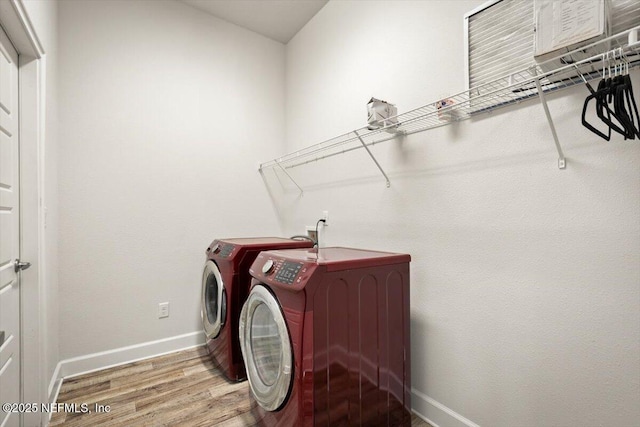 7271 Gateway Ct, Jacksonville, FL 32219 - clothes washing area with independent washer and dryer, wood finished floors, and baseboards