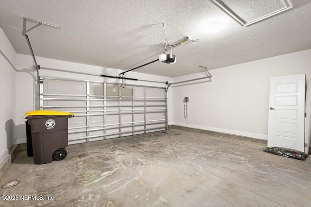 7271 Gateway Ct, Jacksonville, FL 32219 - garage featuring a garage door opener and baseboards
