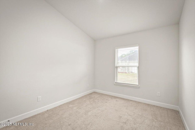 7271 Gateway Ct, Jacksonville, FL 32219 - unfurnished room with light colored carpet, baseboards, and vaulted ceiling