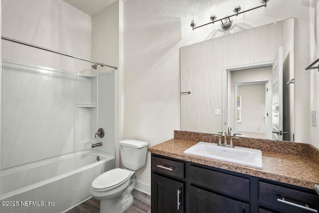 7271 Gateway Ct, Jacksonville, FL 32219 - bathroom featuring toilet, wood finished floors, vanity, shower / bath combination, and baseboards