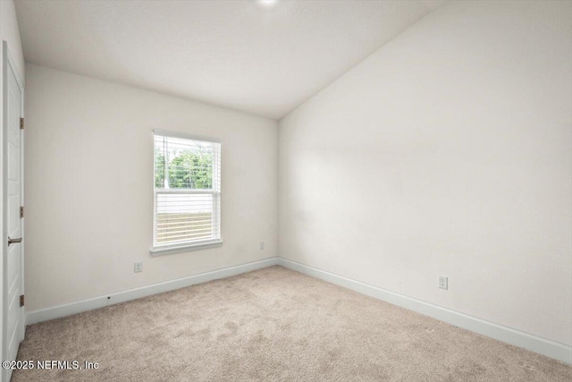 7271 Gateway Ct, Jacksonville, FL 32219 - empty room with carpet floors, baseboards, and lofted ceiling