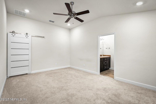 7271 Gateway Ct, Jacksonville, FL 32219 - unfurnished bedroom with carpet flooring, vaulted ceiling, baseboards, ensuite bath, and a sink