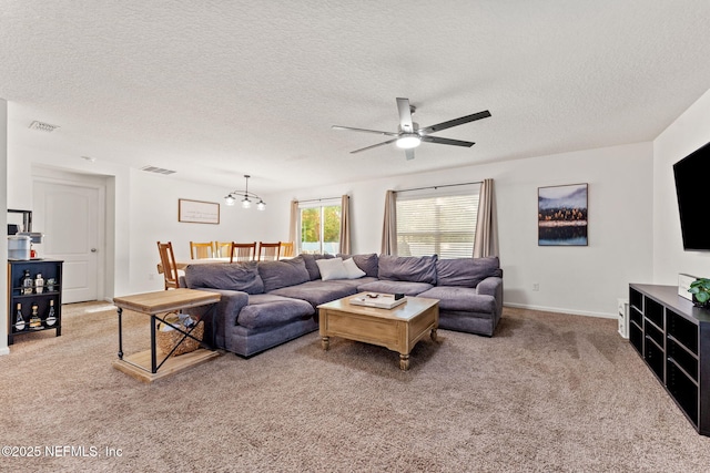 9087 Leicestershire Ct, Jacksonville, FL 32219 - carpeted living area featuring a textured ceiling, visible vents, and ceiling fan with notable chandelier