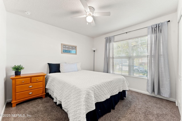 9087 Leicestershire Ct, Jacksonville, FL 32219 - bedroom with a textured ceiling, baseboards, dark colored carpet, and a ceiling fan