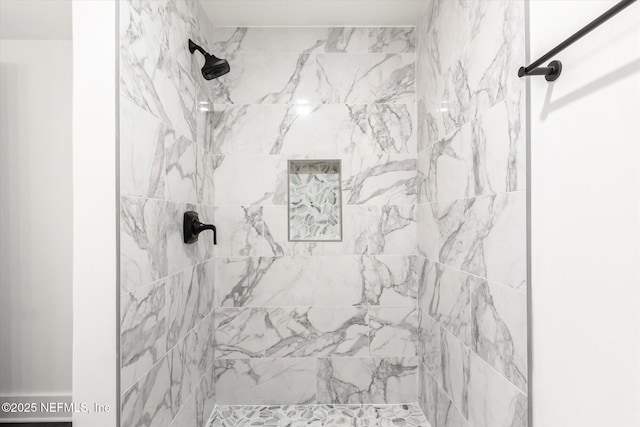 full bath featuring a tile shower