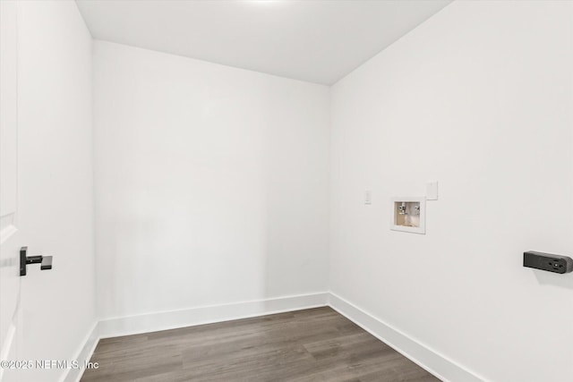 washroom featuring baseboards, wood finished floors, hookup for a washing machine, and laundry area