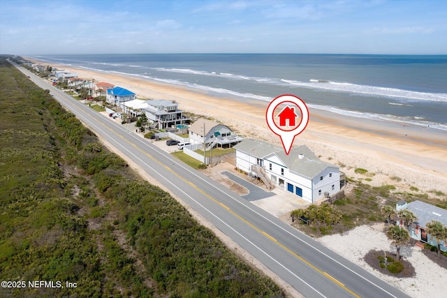 aerial view with a view of the beach and a water view