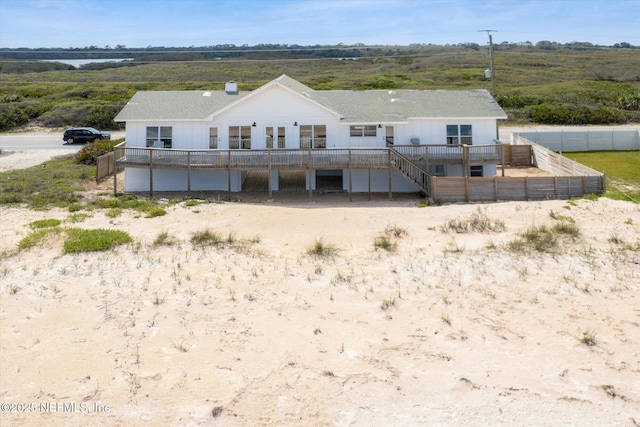 rear view of house with fence
