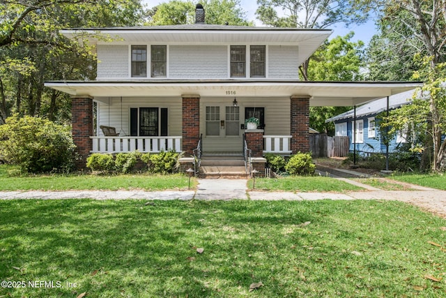 1516 Aberdeen St, Jacksonville, FL 32205 - traditional style home with a front lawn, covered porch, and brick siding