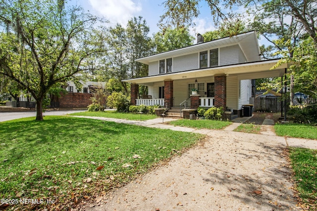 1516 Aberdeen St, Jacksonville, FL 32205 - view of front of property with a front yard, covered porch, a chimney, fence, and brick siding
