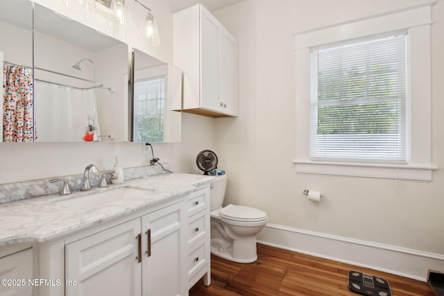 1516 Aberdeen St, Jacksonville, FL 32205 - full bathroom with vanity, toilet, a shower with shower curtain, baseboards, and wood finished floors