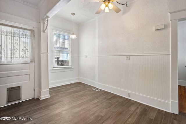 1516 Aberdeen St, Jacksonville, FL 32205 - unfurnished dining area featuring dark wood-style floors, wainscoting, and ceiling fan