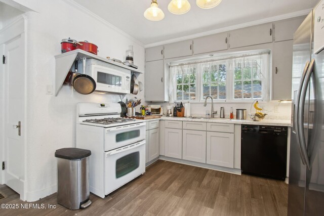 1516 Aberdeen St, Jacksonville, FL 32205 - kitchen featuring dark wood-style flooring, light countertops, crown molding, white appliances, and a sink
