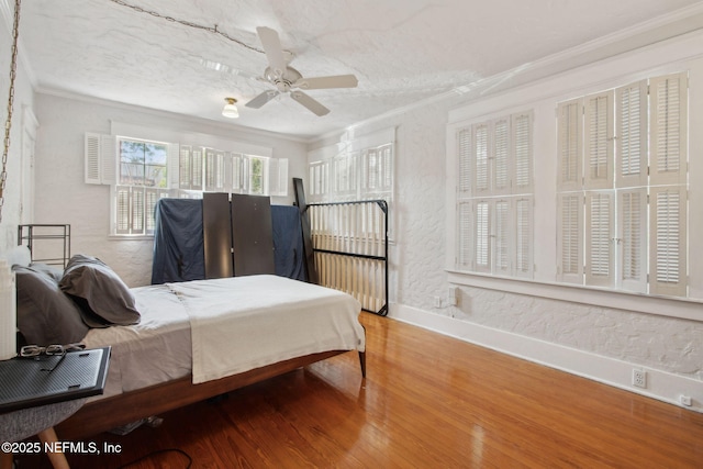 1516 Aberdeen St, Jacksonville, FL 32205 - bedroom with baseboards, crown molding, wood finished floors, and a textured wall
