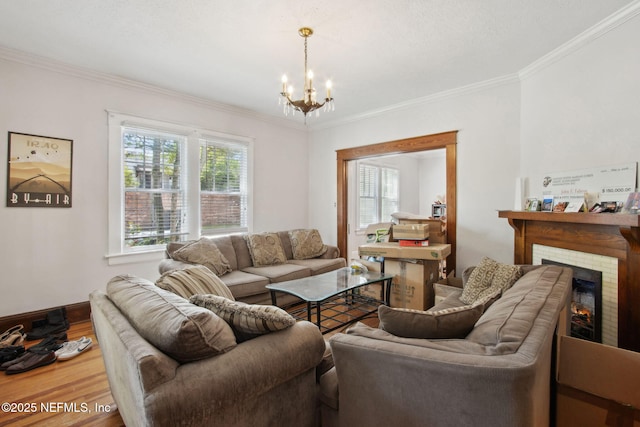 1516 Aberdeen St, Jacksonville, FL 32205 - living room featuring a notable chandelier, wood finished floors, a brick fireplace, baseboards, and ornamental molding