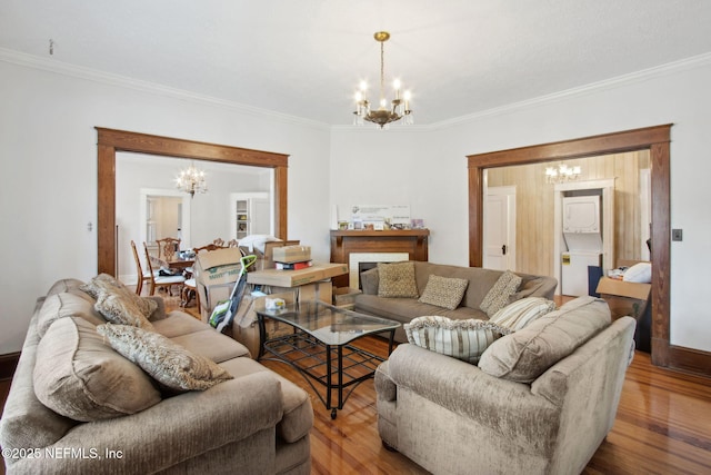 1516 Aberdeen St, Jacksonville, FL 32205 - living room with baseboards, crown molding, wood finished floors, and a chandelier