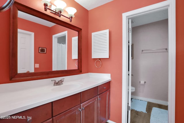 11 Arbor Club Dr Unit 212, Ponte Vedra Beach, FL 32082 - full bathroom featuring toilet, vanity, and baseboards