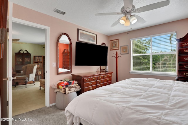11 Arbor Club Dr Unit 212, Ponte Vedra Beach, FL 32082 - carpeted bedroom featuring visible vents, ceiling fan, and a textured ceiling